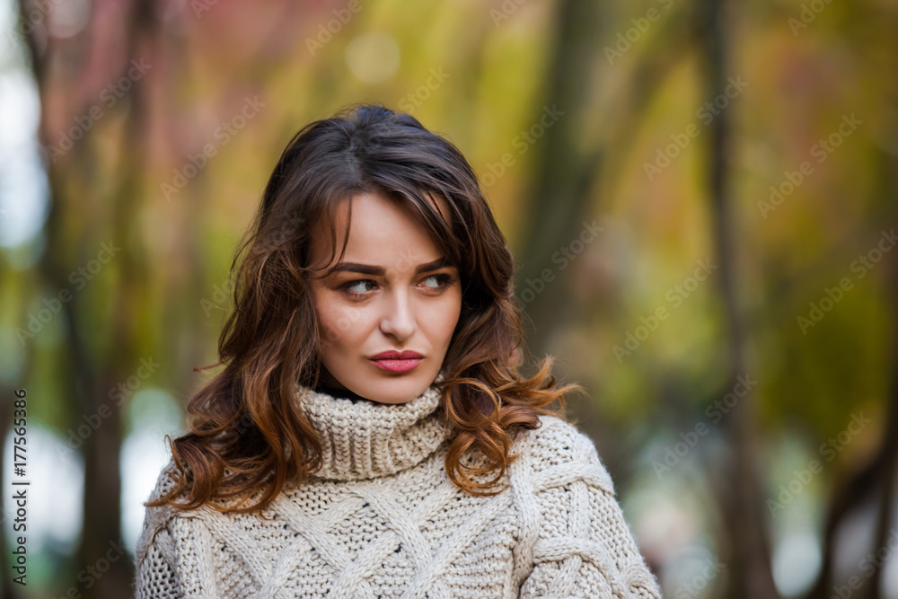 Beautiful emotional woman in an autumn park, looking away. Beautiful emotional woman in an autumn park, looking away.