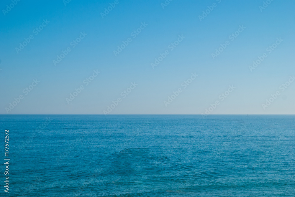 perfect clear blue sky and water of Atlantic Ocean.