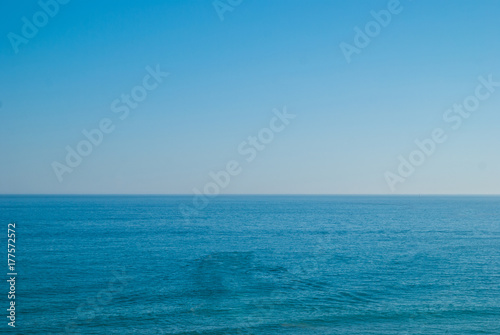 perfect clear blue sky and water of Atlantic Ocean.