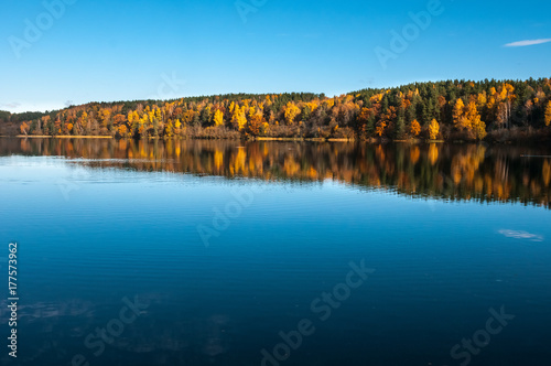 calm lake, colorful autumn and blue sky