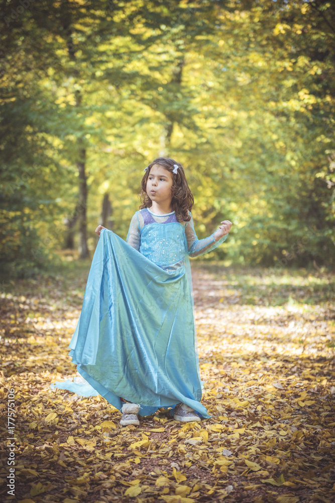 Happy little girl playing in the woods,selective focus Happy little girl playing in the woods,selective focus