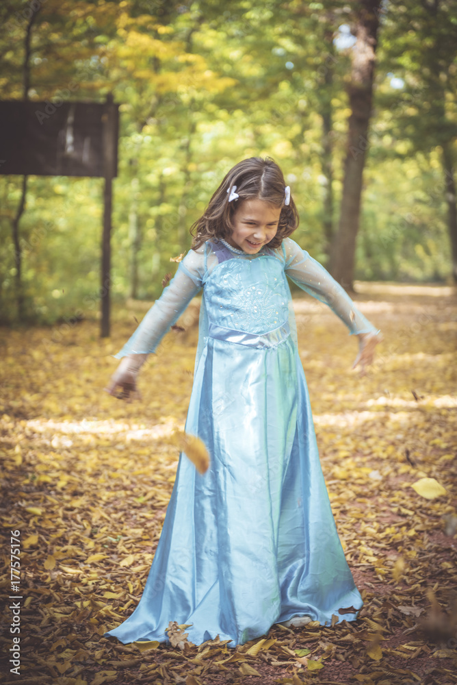 Playful little girl playing in the wood,blurred motion Playful little girl playing in the wood,blurred motion