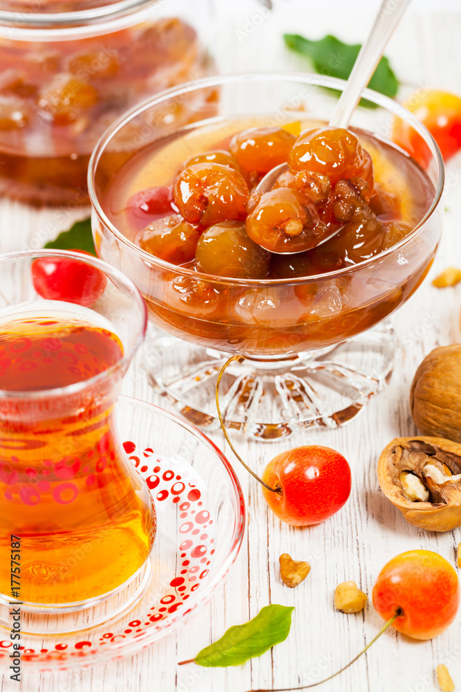 Cherry Jam with Nuts. Azerbaijani Cuisine White Cherry Preserves. Selective focus. Cherry Jam with Nuts. Azerbaijani Cuisine White Cherry Preserves. Selective focus.