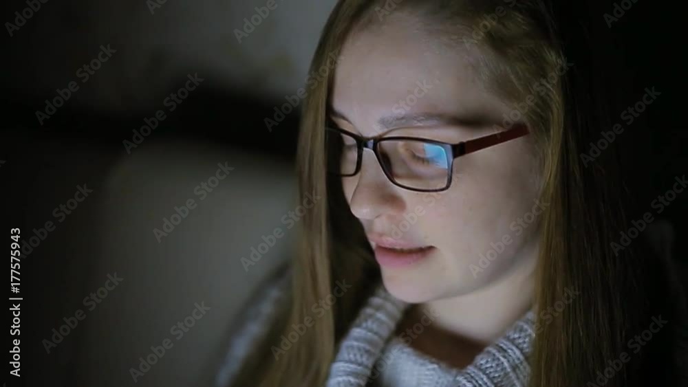 beautiful woman wearing glasses prescribes on laptop late at night at home, very surprised beautiful woman wearing glasses prescribes on laptop late at night at home, very surprised