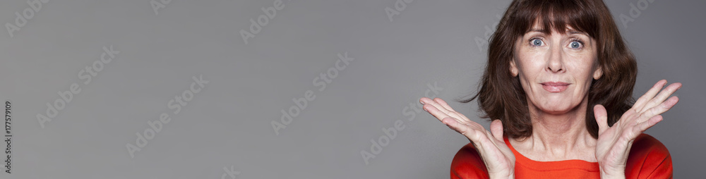 vibrant middle aged woman expressing hopelessness and blame, gray banner vibrant middle aged woman expressing hopelessness and blame, gray banner