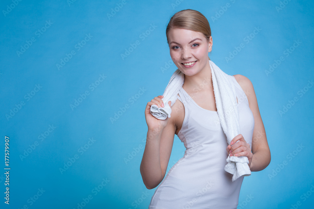 Woman with a towel around her shoulders smiling Woman with a towel around her shoulders smiling