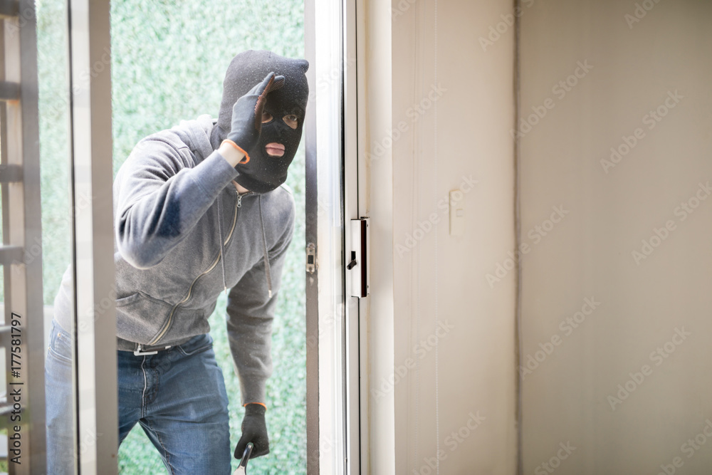 Man getting ready to rob a house Man getting ready to rob a house