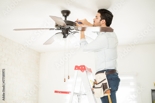Handyman installing a ceiling fan