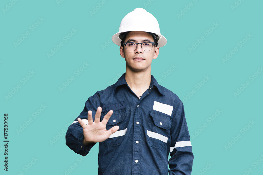 Asian man,Engineer or Technician in white helmet, glasses and blue working shirt suit pointing finger, isolated on white, mechanic and Oil and Gas industrial concept with clipping path Asian man,Engineer or Technician in white helmet, glasses and blue working shirt suit pointing finger, isolated on white, mechanic and Oil and Gas industrial concept with clipping path