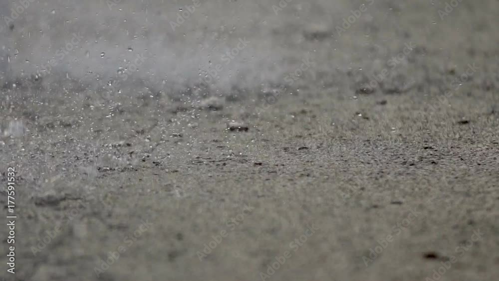 Fountain Rain Drops. Slow movement of the surface of the water splashes a river or pond. Heavy rain or working fountain. Drops of water fall down the macromolecule