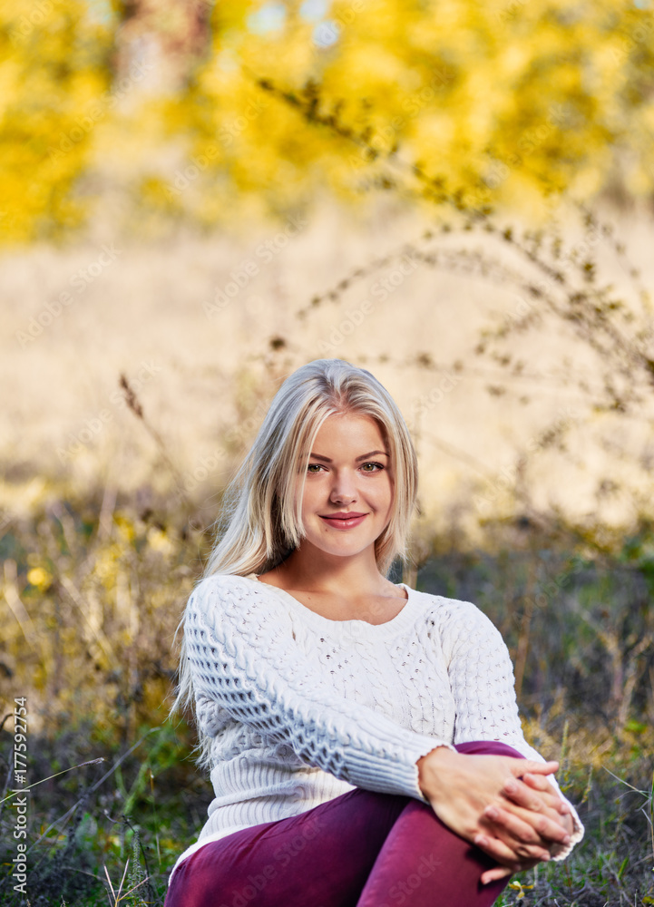 young Woman sitting in grass