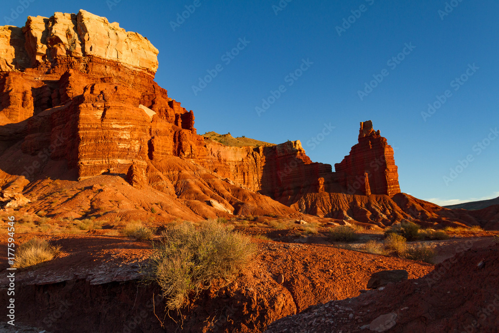 Amazing warm sunset view of Chimney Rock in Capitol Reef National Park in Utah.