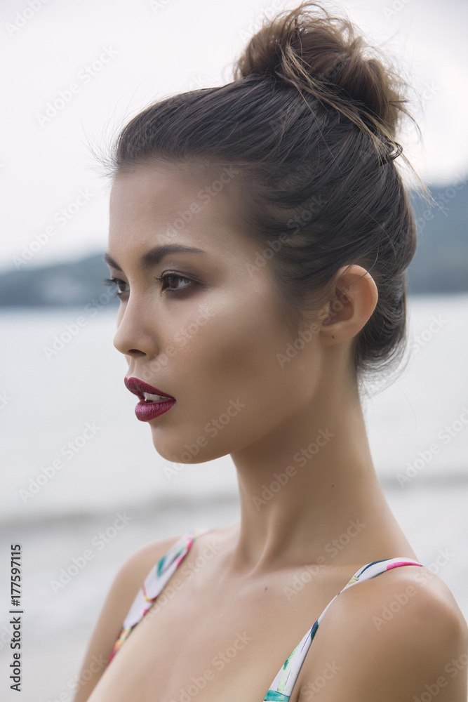 Spa resort beauty portrait of woman looking at camera serene outside. Beautiful skin care concept with multiethnic model girl with perfect skin. Spa resort beauty portrait of woman looking at camera serene outside. Beautiful skin care concept with multiethnic model girl with perfect skin.
