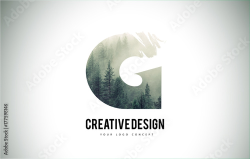 G Letter Brush with Forest Fog Texture. Forest Trees Letter Logo Design.