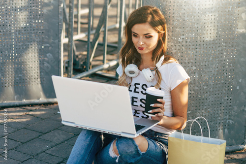 Young woman in white T-shirt with word 