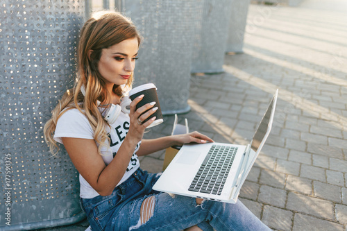 Young woman in white T-shirt with word 