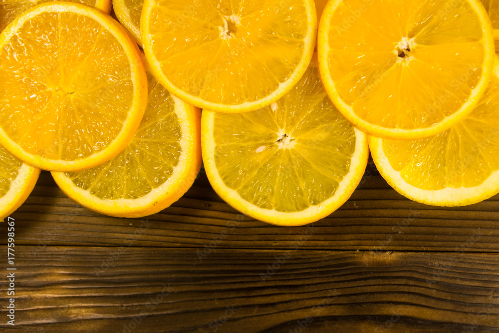 Sliced oranges on wooden table Sliced oranges on wooden table