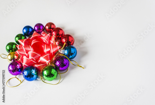 Red Christmas decorations on a light background. Christmas card. Winter holiday theme.