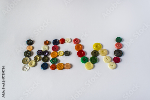 Many different buttons. Buttons for clothes made of plastic. View from above.