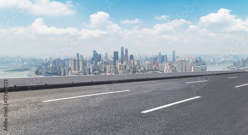 Road pavement and city skyline