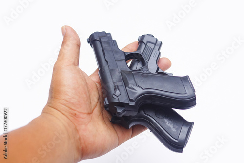 Handgun On Hand Over White Background