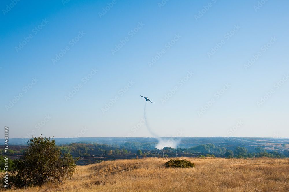 Firefighter airplane extinguishes a forest fire Firefighter airplane extinguishes a forest fire