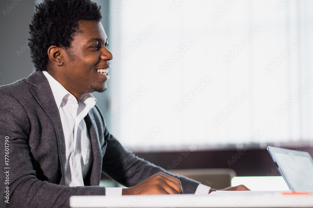Young man sitting at desk, business concept, education, office worker. Young man sitting at desk, business concept, education, office worker.