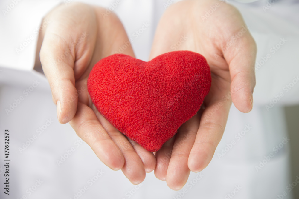 woman doctor red heart with stethoscope. Healthcare and medical concept woman doctor red heart with stethoscope. Healthcare and medical concept