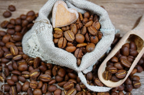 Coffee beans - coffee beans in a linen bag - selective focus © skorpionik00