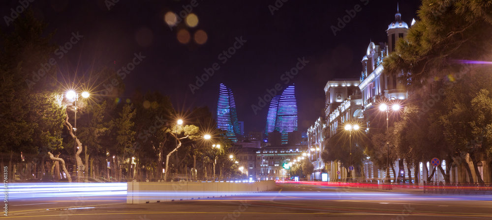 Bright Baku nights. Moment of time. Panoramic view of Baku. Night routes in Baku. Flame Towers . Night street traffic on Heydar Aliyev avenue. Baku, Azerbaijan
