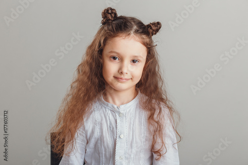 t-shirt design concept - smiling little girl in blank white t-shirt photo