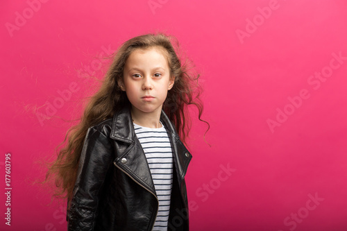 Closeup portrait of pretty little girl in studio photo