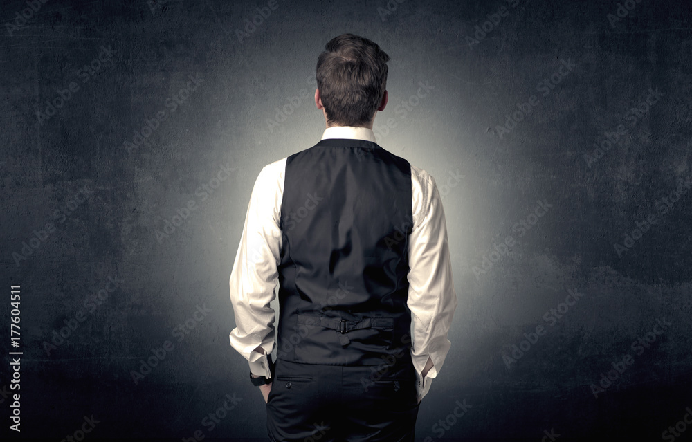 Businessman standing and thinking Businessman standing and thinking