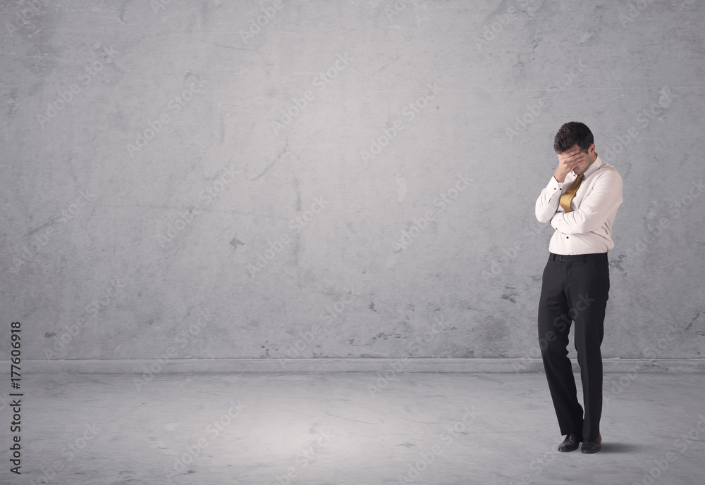 Young businessman standing confused Young businessman standing confused
