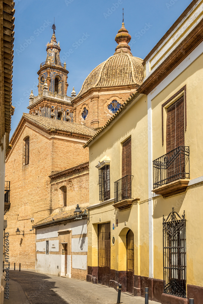 View from narrow street at the church Santa Maria in Ecija, Spain