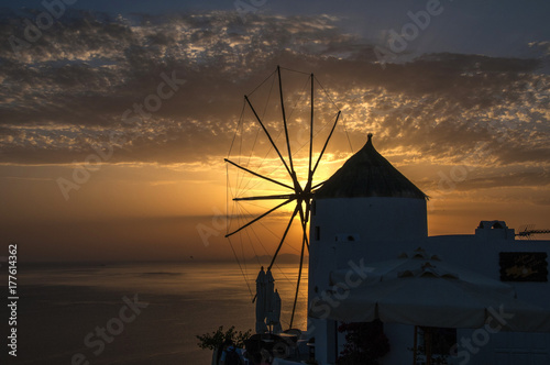 Sunset and windmill on the Island of Santorini, Greece