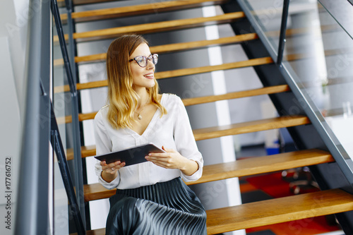 Young woman with tablet in ...