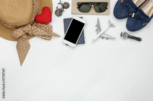 Table top view of accessories fashion women to travel concept.Mix essential objects on the modern wood white background at home office desk.Items for traveler teen or adult to holidays and copy space.