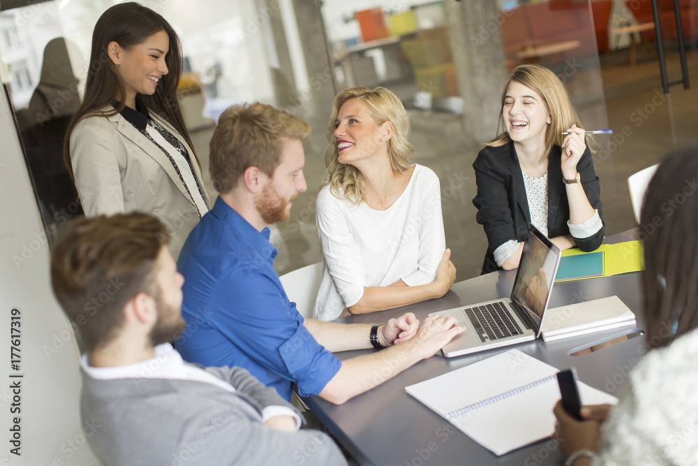 Business team working together in modern office Business team working together in modern office