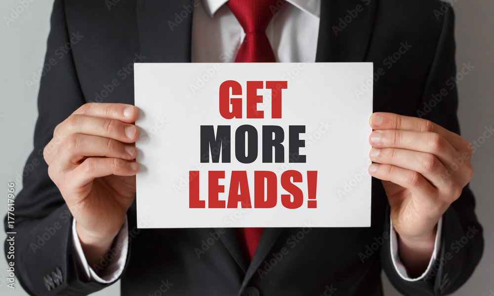 Businessman holding a card with text Get More leads Businessman holding a card with text Get More leads