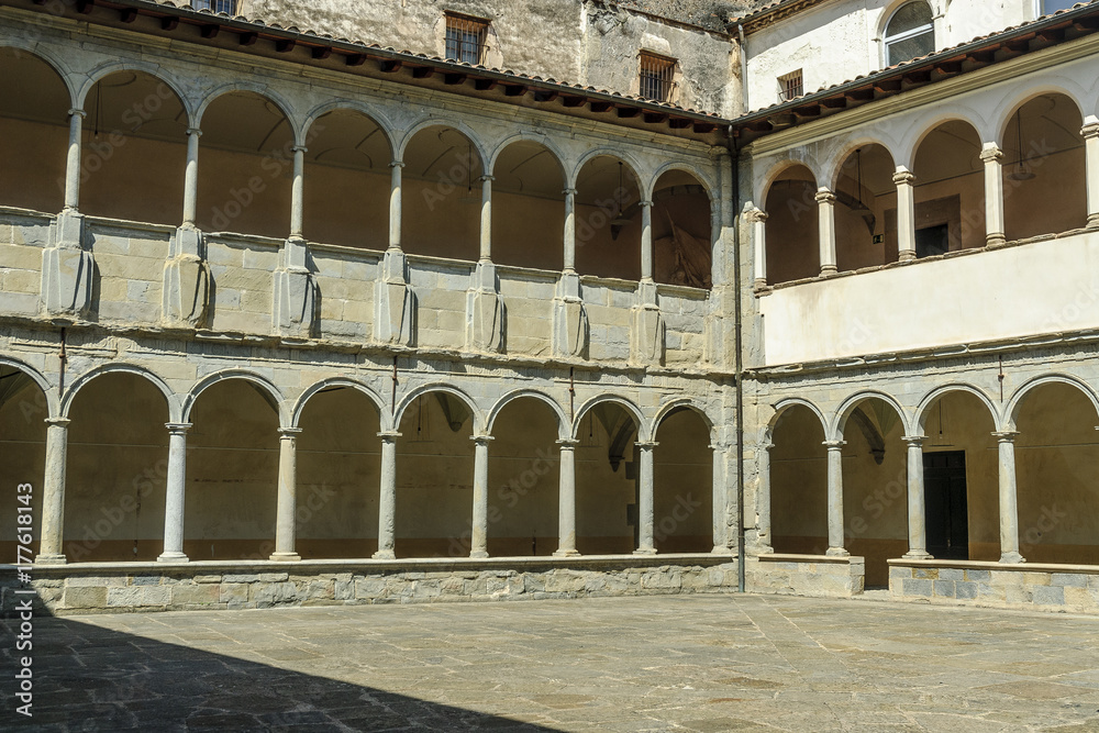 details of the courtyard of the cloister of an ancient monastery in the Olot town in Gerona, Spain.