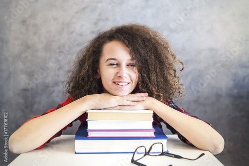 Happy curly hair teen girl ...