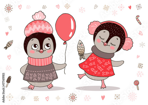Cute little penguins girl in warm clothes and ear muffs