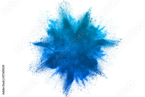 Freeze motion of blue powder explosions isolated on white background photo
