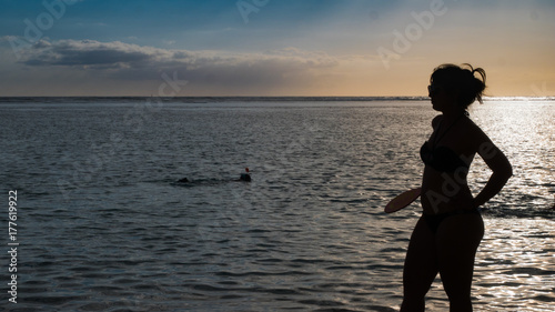 woman playing in the sunset