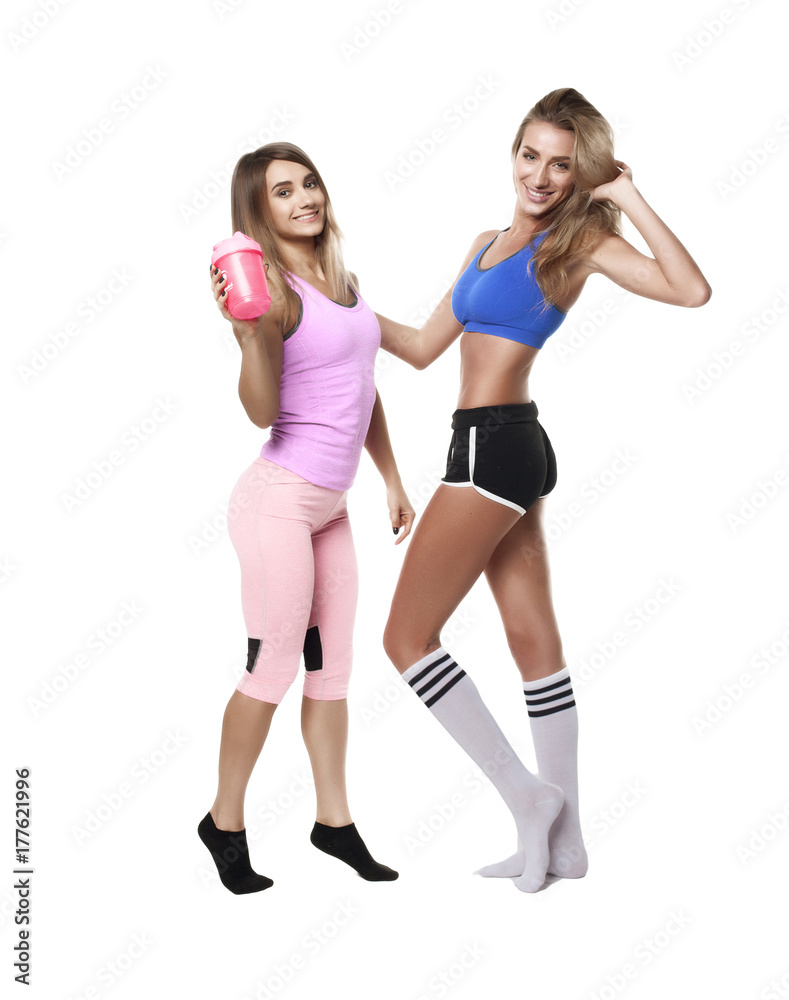 two jumping fitness girl on white background two jumping fitness girl on white background