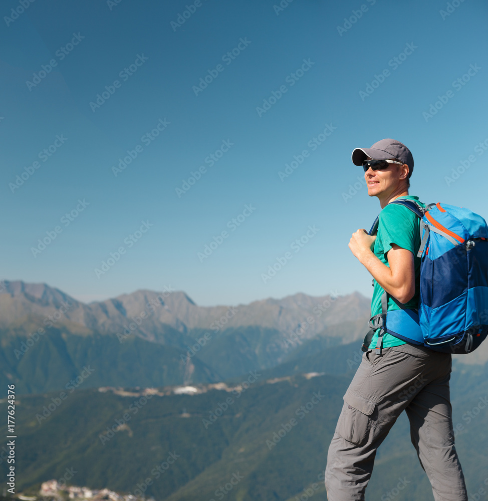 Picture of tourist man in sunglasses with backpack