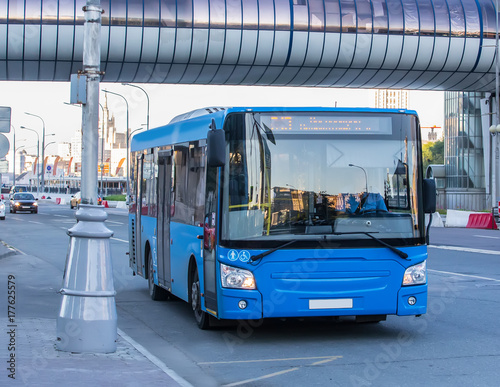 bus goes along street