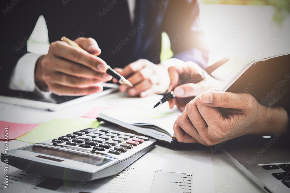 Business team support and meeting concept. Group of Investor working and pointing at financial paperwork Finance task. Business team support and meeting concept. Group of Investor working and pointing at financial paperwork Finance task.