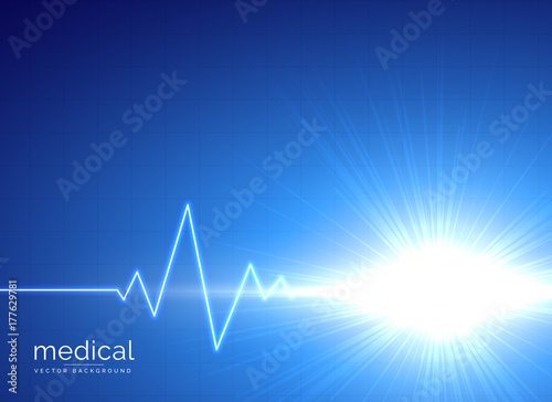 blue medical background with electrocardiogram